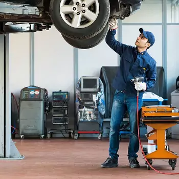 Mechanic working in a transmission repair shop